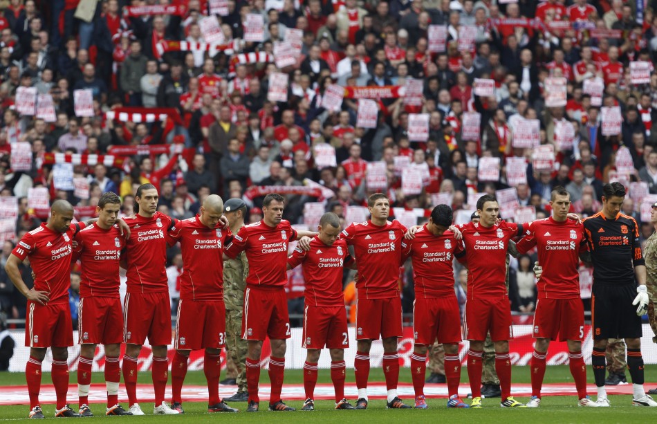 Liverpool039s players stand for a minute039s silence before their FA Cup semi-final soccer match against Everton in London