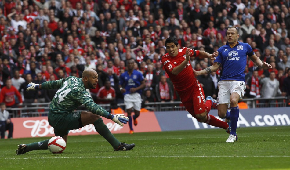 Liverpool039s Luis Suarez shoots and scores his goal against Everton during their English FA Cup semi-final soccer match at Wembley Stadium in London