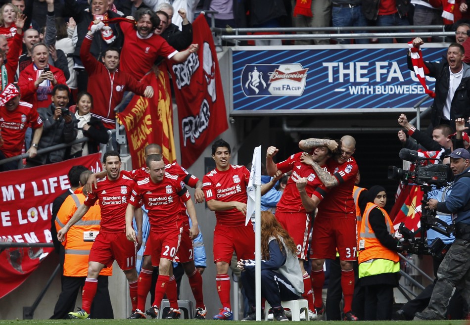 Liverpool039s Carroll celebrates his goal against Everton with teammates during their FA Cup semi-final soccer match in London