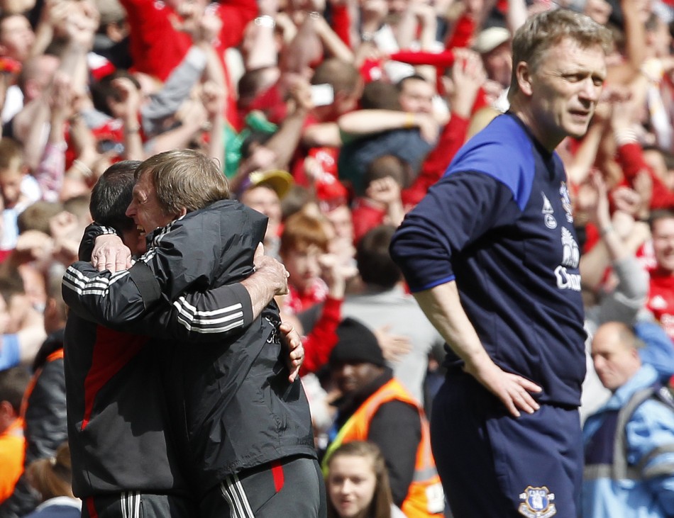 Liverpool039s manager Dalglish celebrates winning as his Everton counterpart Moyes reacts after their FA Cup semi-final soccer match in London