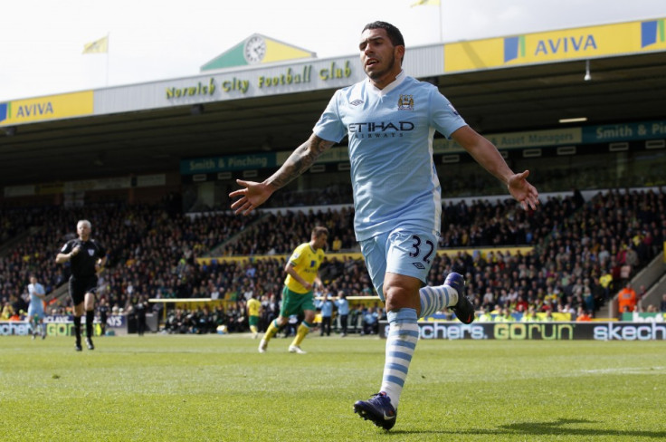 Carlos Tevez celebrates one of his three goals against Norwich.