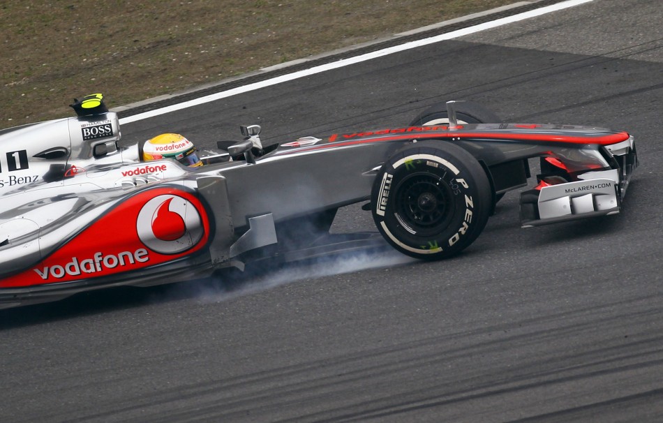 McLaren Formula One driver Hamilton brakes during the Chinese F1 Grand Prix at Shanghai circuit