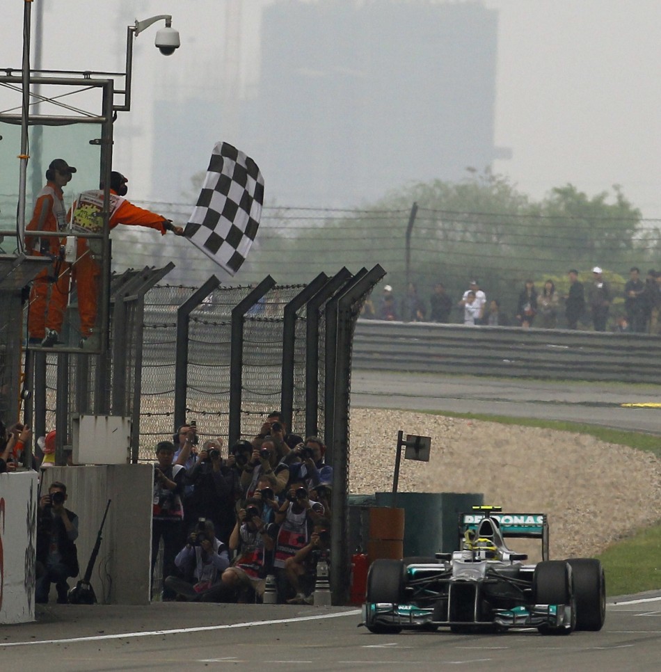 Mercedes Formula One driver Rosberg takes the chequered flag to win the Chinese F1 Grand Prix at Shanghai circuit