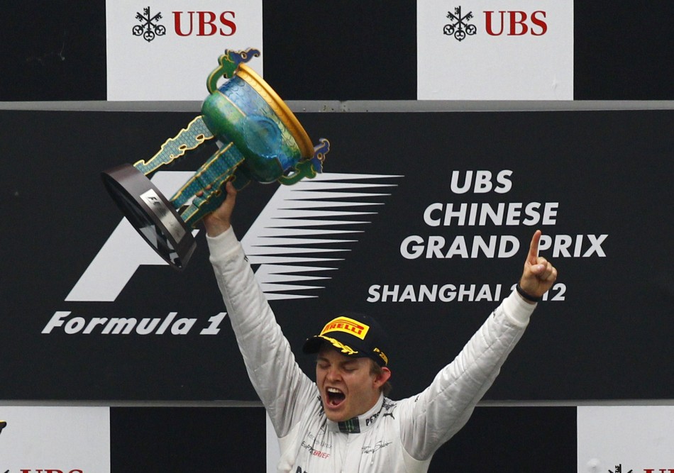 Mercedes Formula One driver Rosberg celebrates on the podium winning the Chinese F1 Grand Prix at Shanghai circuit