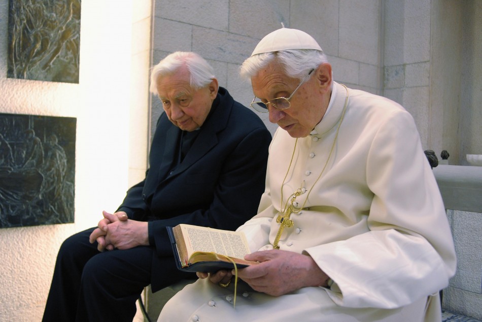Pope Benedict XVI prays with his brother Mons. Georg Ratzinger in his private chapel at the Vatican