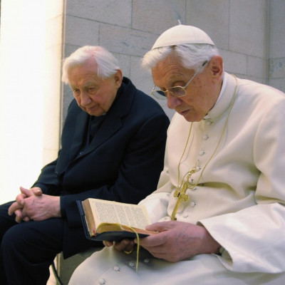 Pope Benedict XVI prays with his brother Mons. Georg Ratzinger in his private chapel at the Vatican
