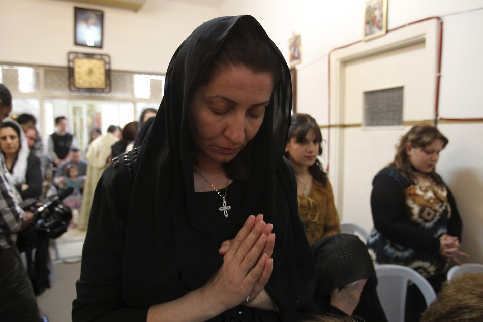 Iraqi Christians attend an Easter mass at Chaldean Catholic church in Amman