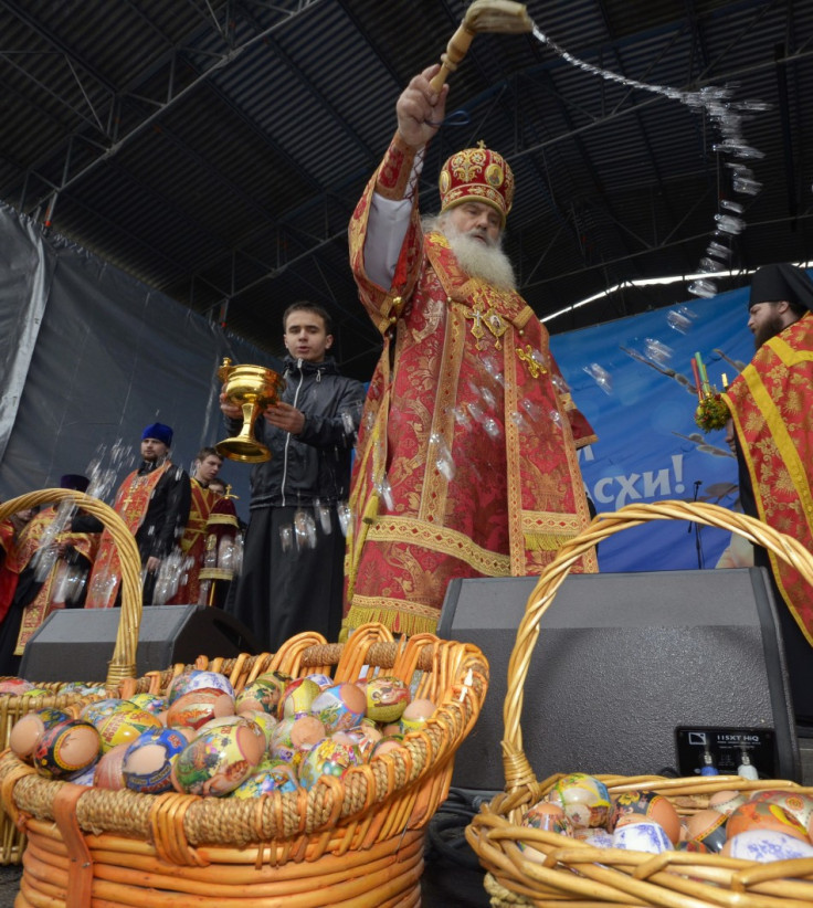An Orthodox priest blesses Easter eggs after a religious service in Russia's far Eastern port of Vladivostok