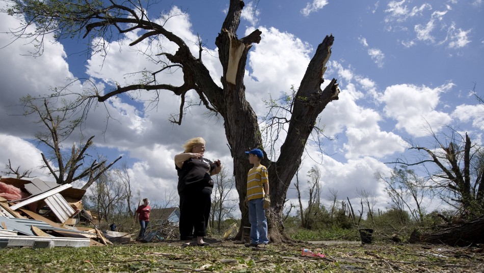 A woman describes her experience after she survived a tornado, to her relative in Thurman, Iowa