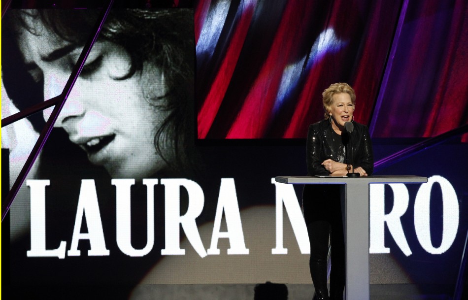 Bette Midler speaks as singer Laura Nyro is posthumously inducted into the 2012 Rock n Roll Hall of Fame in Cleveland, Ohio