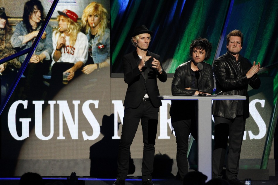 Members of Green Day introduce the band Guns N Roses as they are inducted into the Rock n Roll Hall of Fame in Cleveland, Ohio