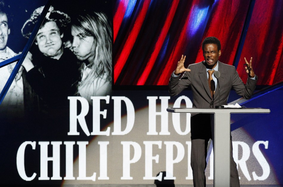 Comedian Chris Rock introduces the Red Hot Chili Peppers during the 2012 Rock n Roll Hall of Fame induction ceremony in Cleveland, Ohio
