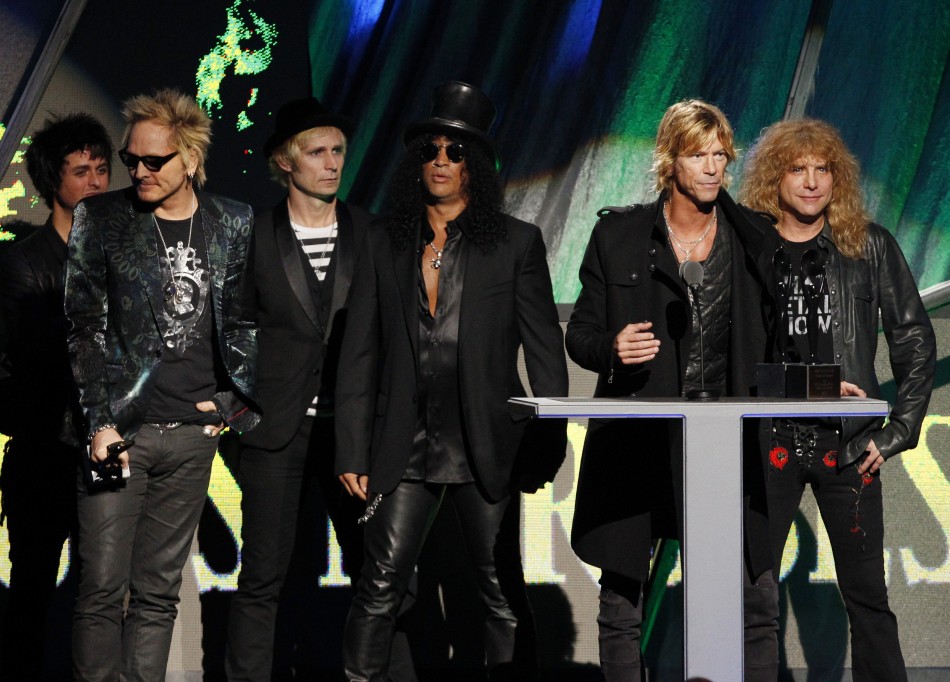 Members of the band Guns N Roses speak after their induction into the Rock n Roll Hall of Fame in Cleveland, Ohio