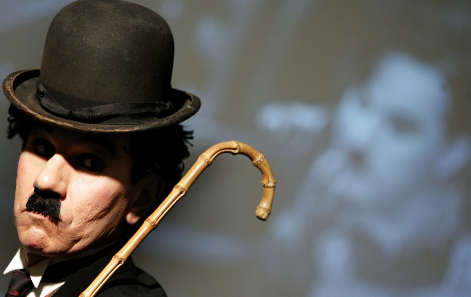 Charlie Chaplin impersonator Tobias Santiago wears the bowler hat and cane used by Charlie Chaplin