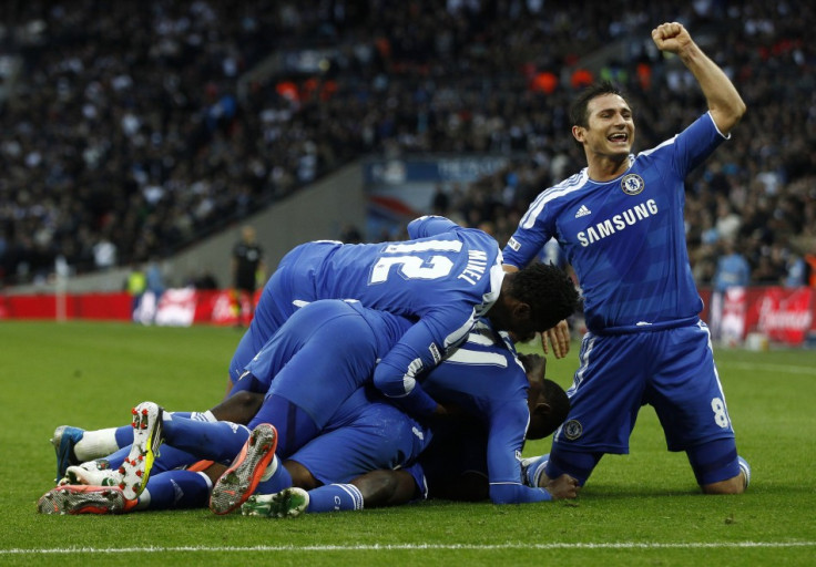 Frank Lampard celebrates as his teammates jump on Ramires after he scored during their FA Cup semi-final match against Tottenham Hotspur (Reuters)