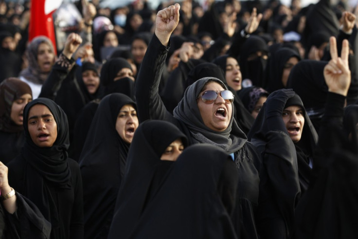 Protesters march in the village of Salmabad, south of Manama