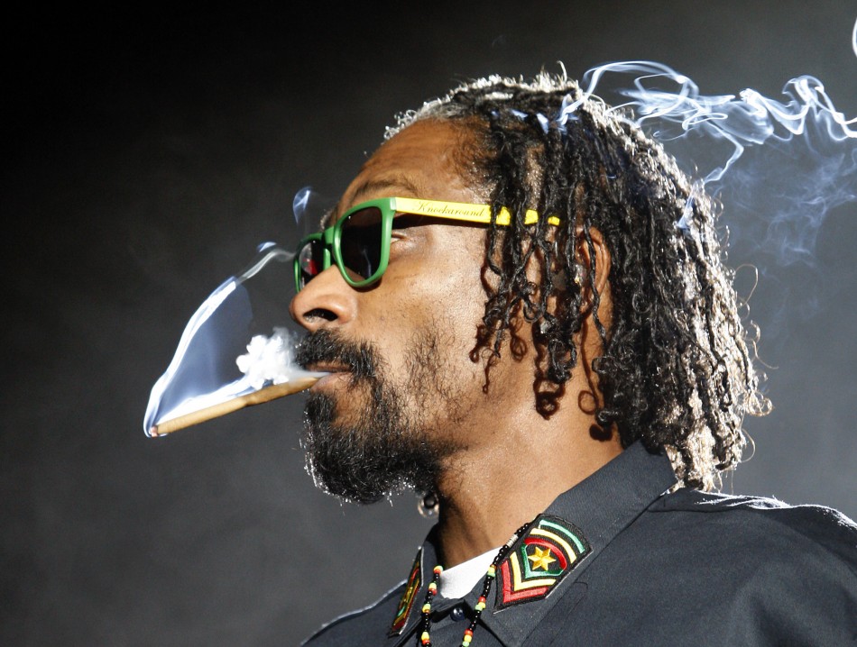 Snoop Dogg smokes while performing at the 2012 Coachella Valley Music and Arts Festival in Indio, California.