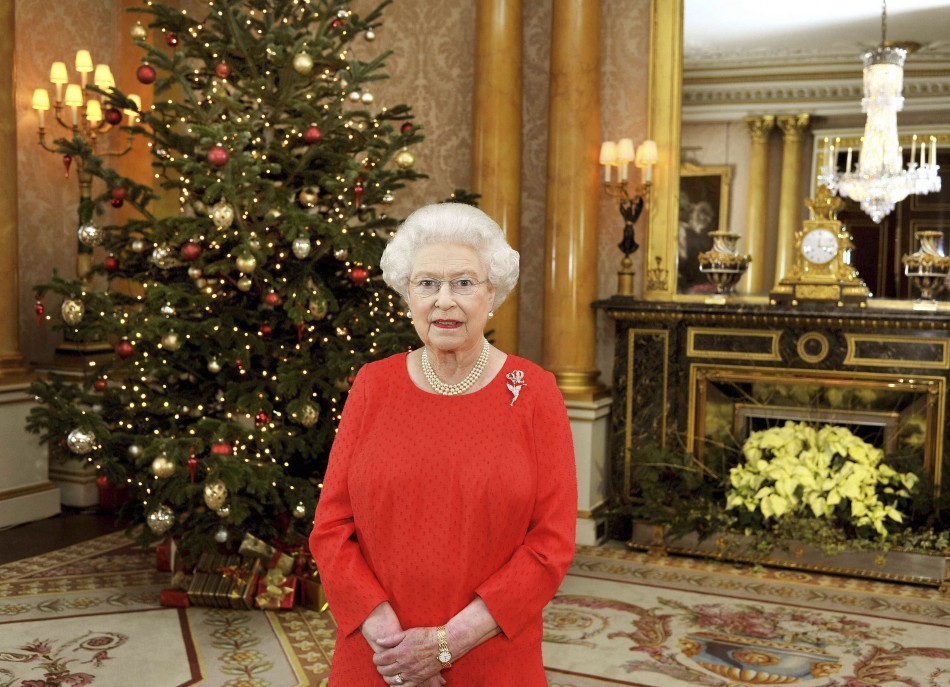 Queen Elizabeth II stands in the 1844 Room of Buckingham Palace in London