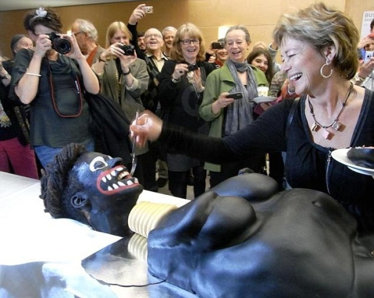 Culture Minister Lena Adelsohn Liljeroth cut 'racist' cake at art event in Stockholm
