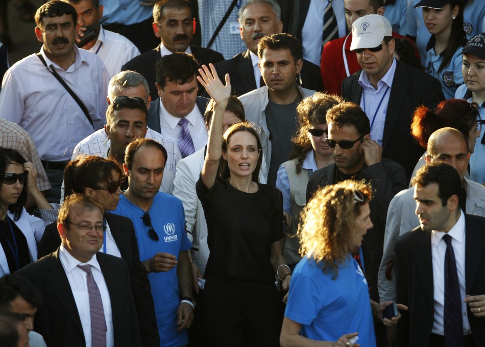 United Nations High Commissioner for Refugees UNHCR Goodwill Ambassador Angelina Jolie greets media members as she leaves from Hatay airport