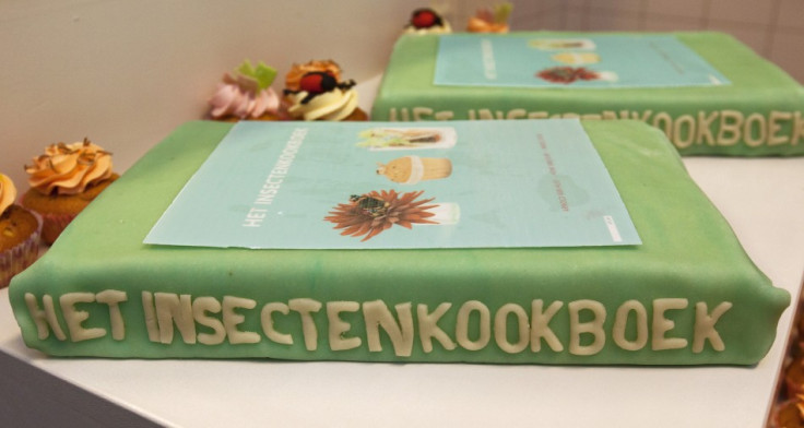 A cake filled with edible insects in the shape of the cookbook 'The Insect Cookbook' (Reuters)