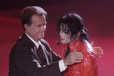 Singer Michael Jackson (R) is thanked by Dick Clark, host of "American Bandstand's 50th...A Celebration" after performing "Dangerous" for the show in Pasadena, California, April 20, 2002.