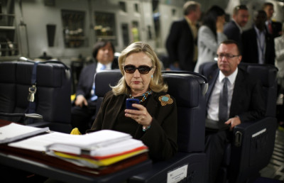 U.S. Secretary of State Hillary Clinton checks her PDA upon her departure in a military C-17 plane from Malta bound for Tripoli, Libya U.S. Secretary of State Hillary Clinton checks her PDA upon her departure in a military C-17 plane from Malta bound for Tripoli, Libya