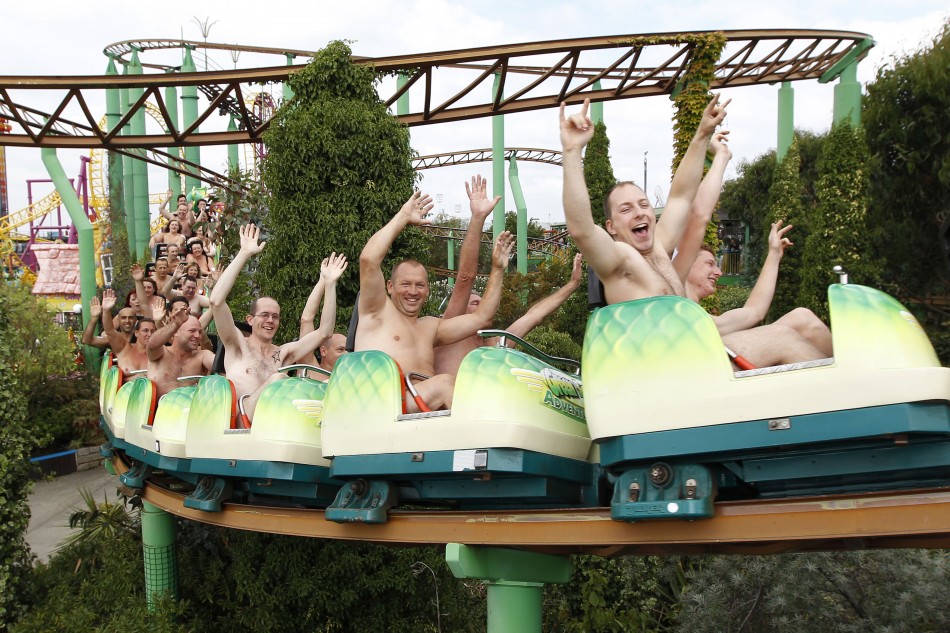 Thrillseekers take part in a world record-breaking nude rollercoaster ride, to raise money for Southend Hospitals breast care unit, at an amusement park in Southend-on-Sea