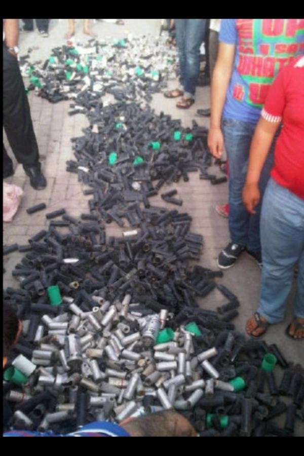 Protesters gathered the tear gas canisters they say were used by security forces