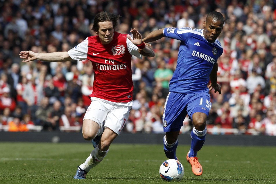 Arsenal039s Rosicky challenges Chelsea039s Malouda during the English Premier League soccer match at the Emirates Stadium in London