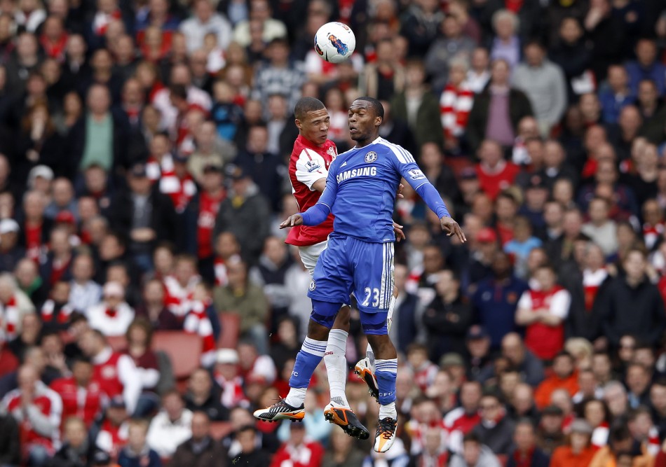 Arsenal039s Gibbs challenges Chelsea039s Sturridge during the English Premier League soccer match at the Emirates Stadium in London