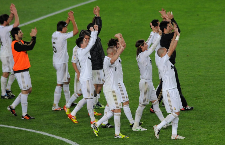 Real Madrids players celebrate victory over Barcelona at the end of their Spanish first division quotEl Clasicoquot soccer match
