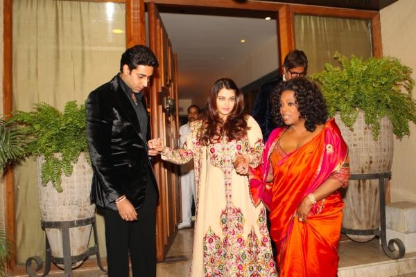 Aishwarya Rai Bachchan is held by Abhishek and Oprah Winfrey Aishwarya Rai Bachchan is held by Abhishek and Oprah Winfrey