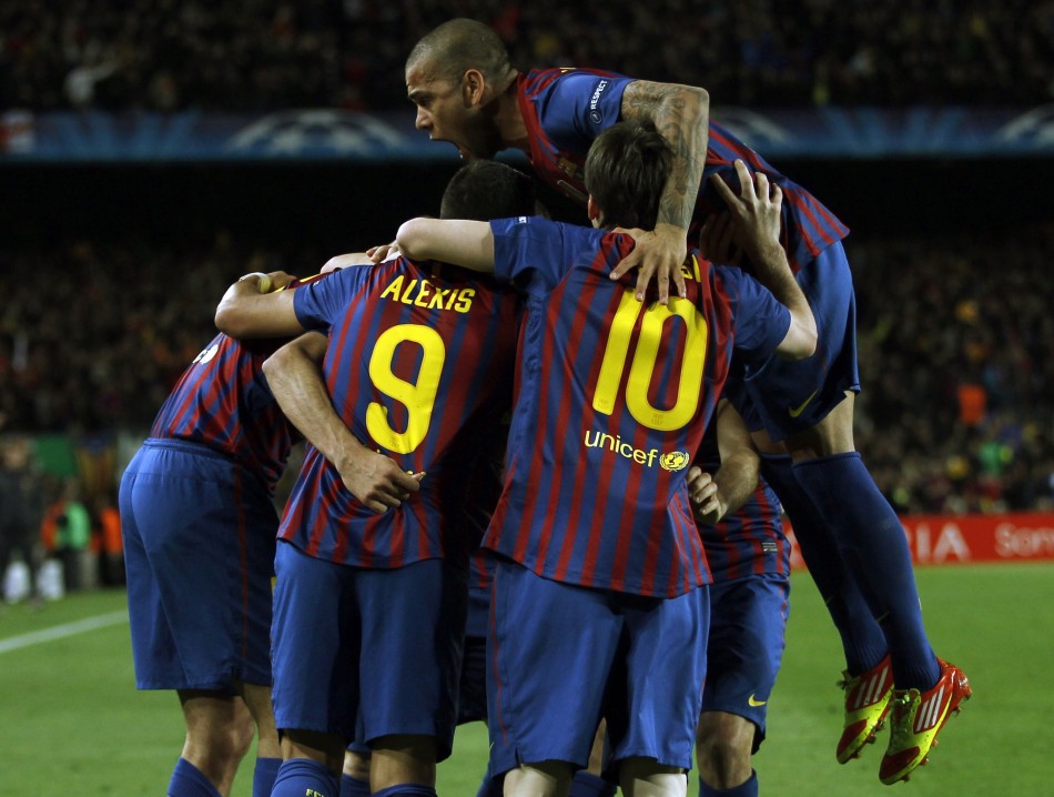 Barcelona039s Dani Alves jumps over team mates as they celebrate a goal against Chelsea during their Champions League soccer semi-final in Barcelona