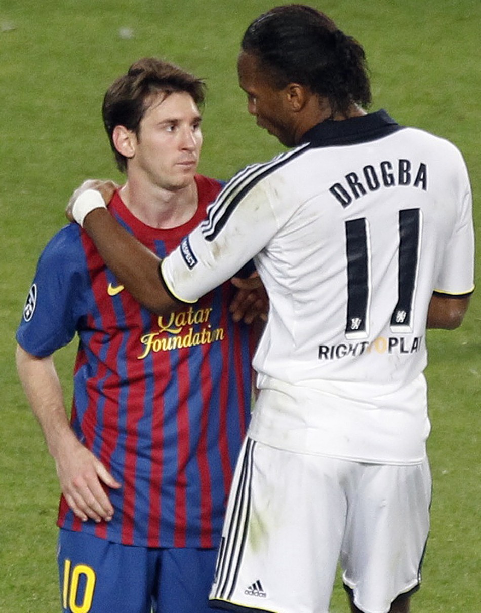 Chelsea039s Drogba comforts Barcelona039s Messi at the end of their Champions League soccer semi-final in Barcelona