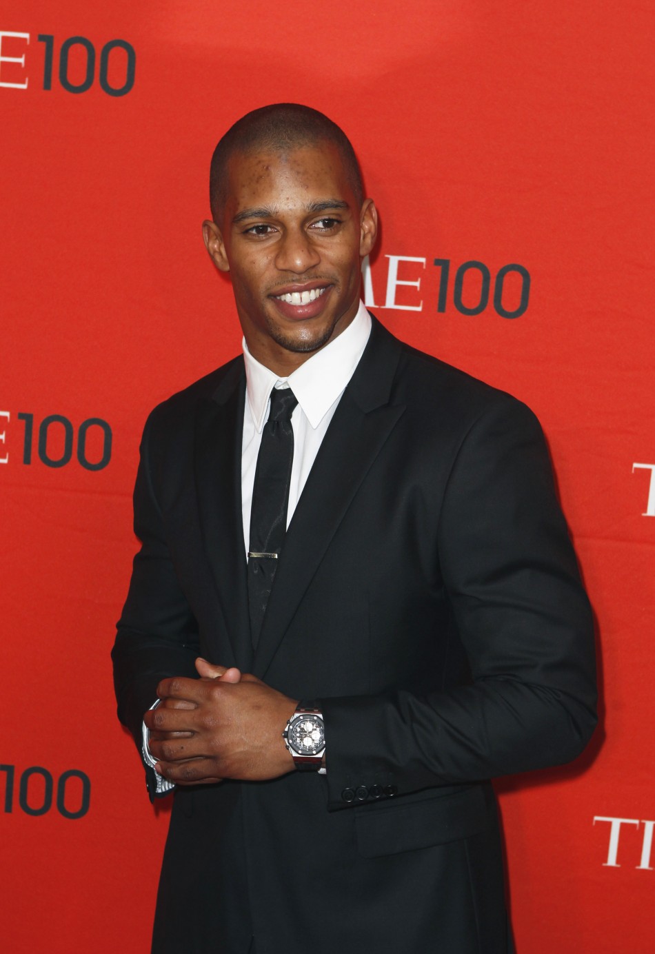 Football player Victor Cruz arrives to be honored at the Time 100 Gala in New York
