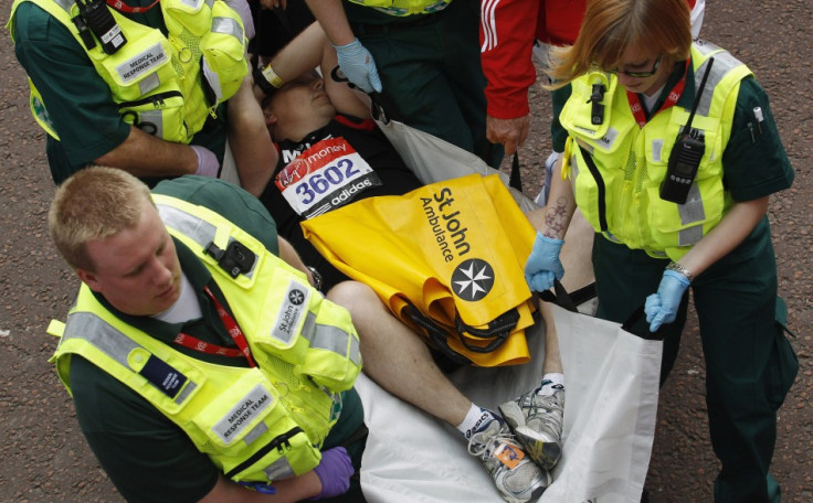 Runner is attended by medics after finishing London Marathon Runner is attended by medics after finishing London Marathon