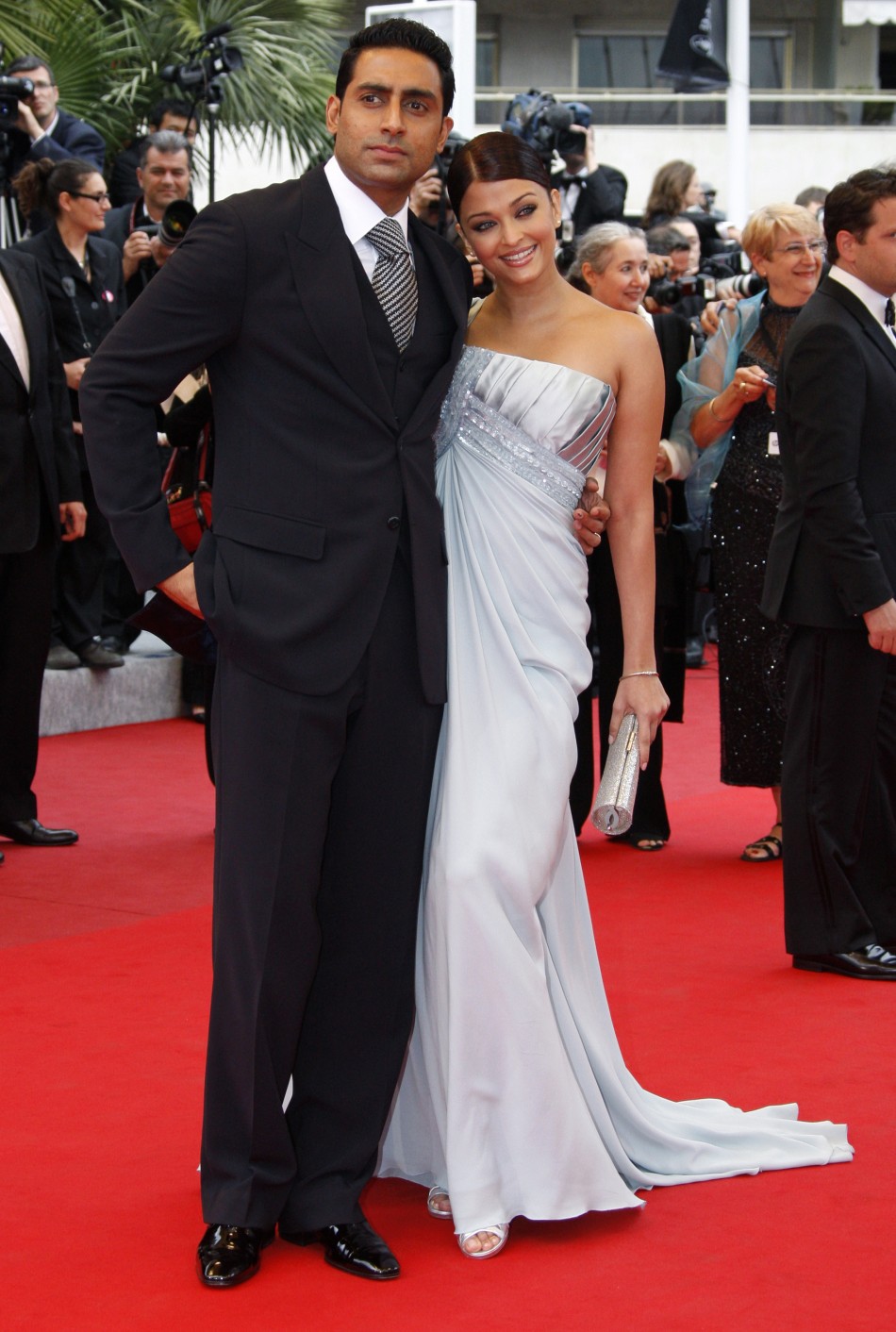 Bollywood actress Aishwarya Rai Bachchan and actor Abhishek Bachchan pose on red carpet as they arrive at 62nd Cannes Film Festival 2009
