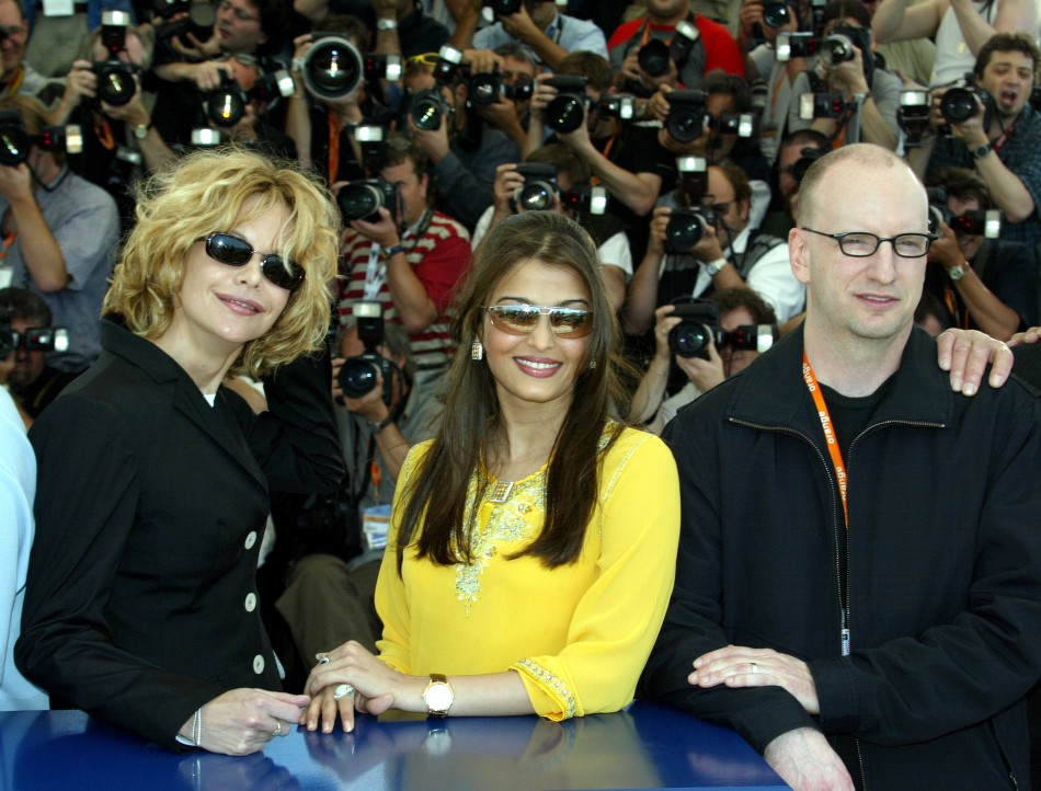Jury members, US actress Meg Ryan L, Indian actress and former Miss World Aishwarya Rai C, and US director Steven Soderbergh R stand together during a photocall on the first day of the 56th International Film Festival in Cannes 2003