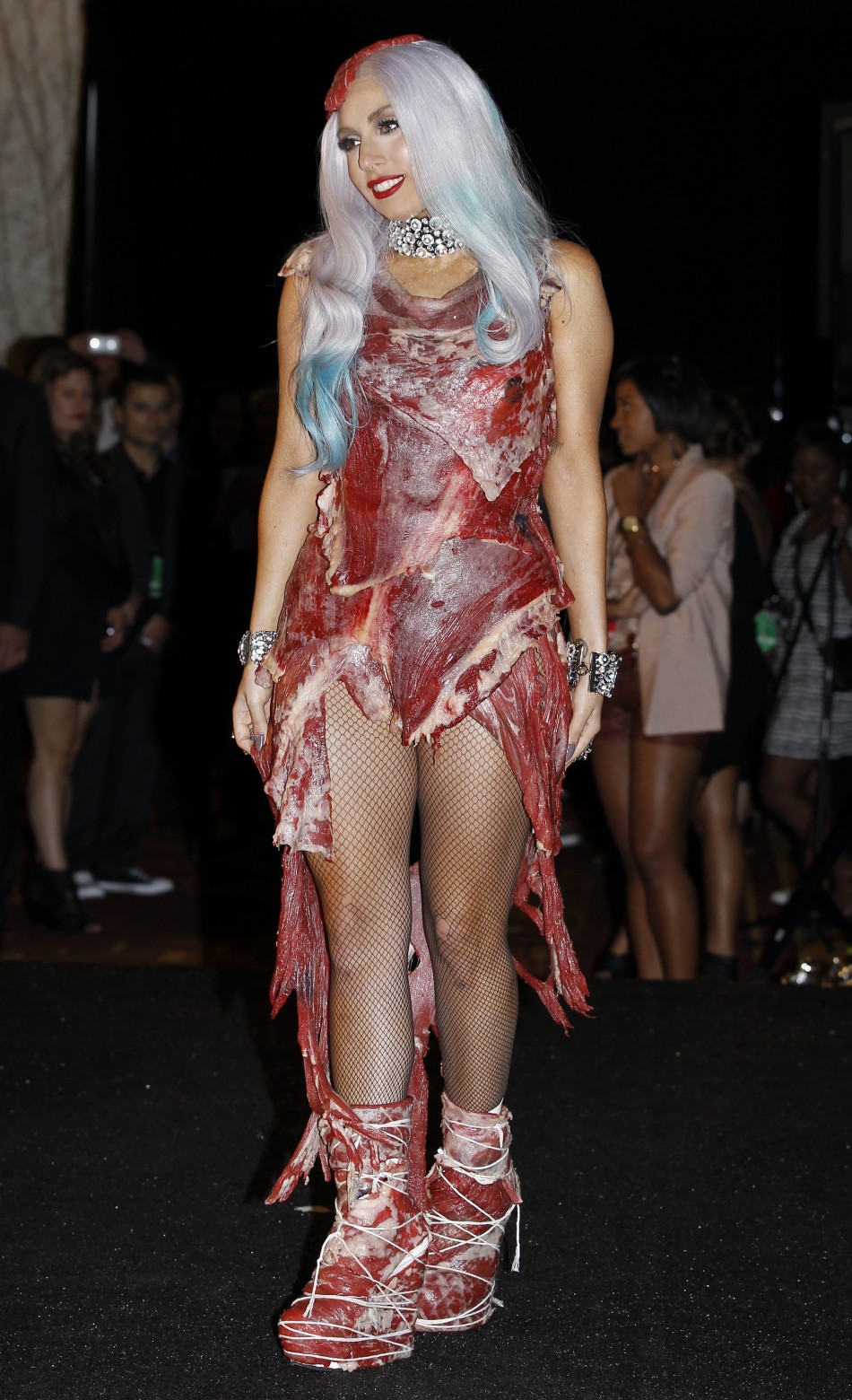Lady Gaga wearing an outfit made of meat poses in the photo room at the 2010 MTV Video Music Awards in Los Angeles