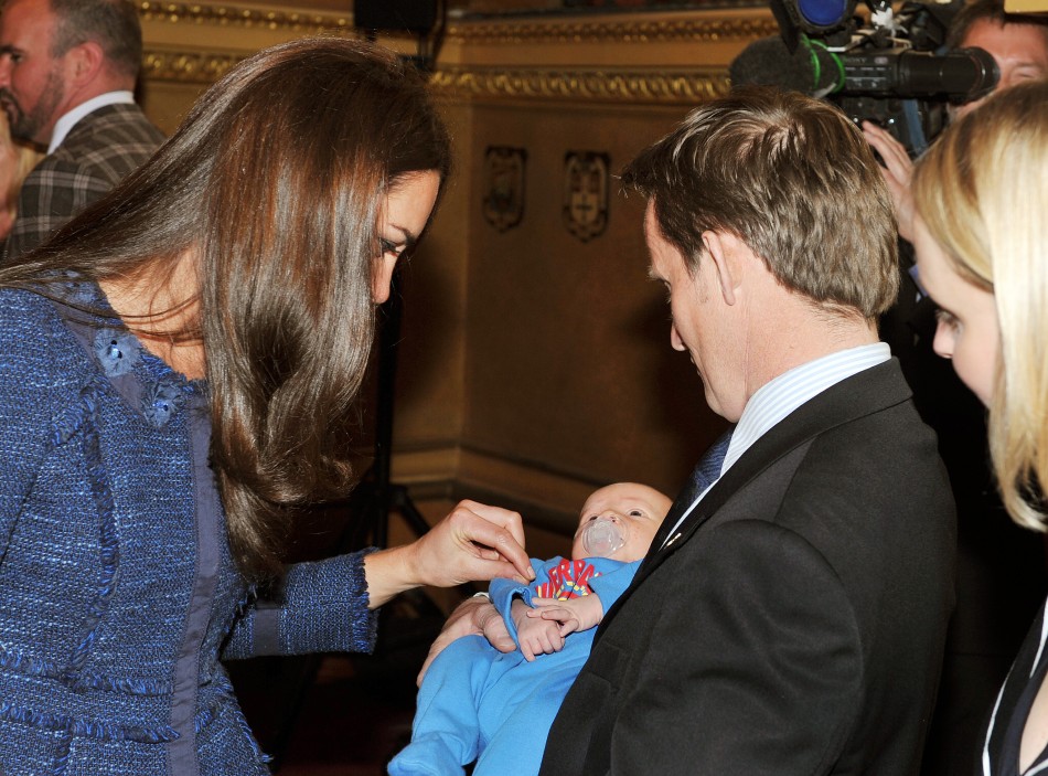 The Duchess of Cambridge talks to Vic Vicary, holding his three week old son Hugo Eric Scott Vicary, at a reception to celebrate the Scott-Amundsen Centenary Race to the South Pole, at Goldsmiths Hall in the City of London