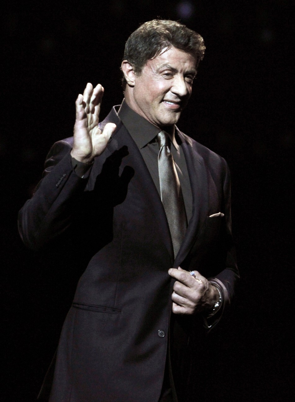 Actor Sylvester Stallone, recipient of the Career Achievement Award, arrives on stage during the CinemaCon Big Screen Achievement Awards show in Las Vegas