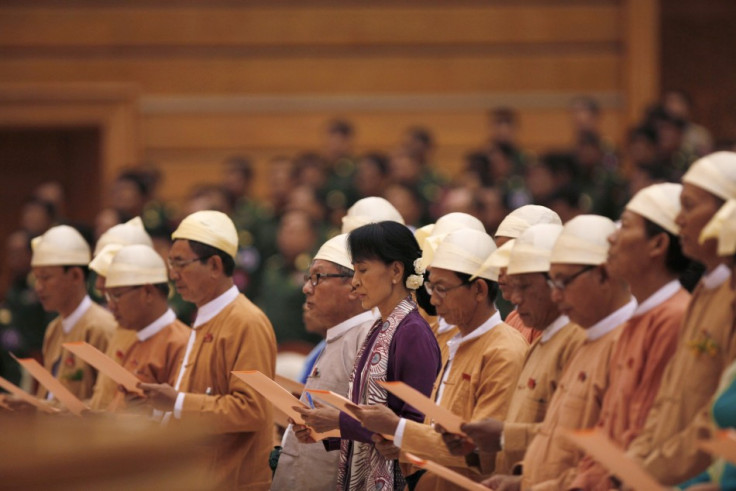 Myanmar pro-democracy leader Aung San Suu Kyi (C) and members of parliament from the National League for Democracy take their oaths