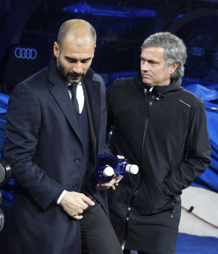 Barcelona's coach Guardiola greets Real Madrid's coach Mourinho