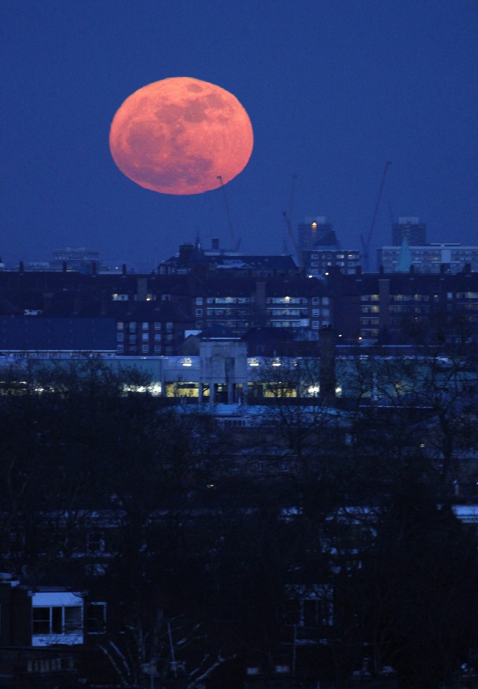 The super moon rises over east London
