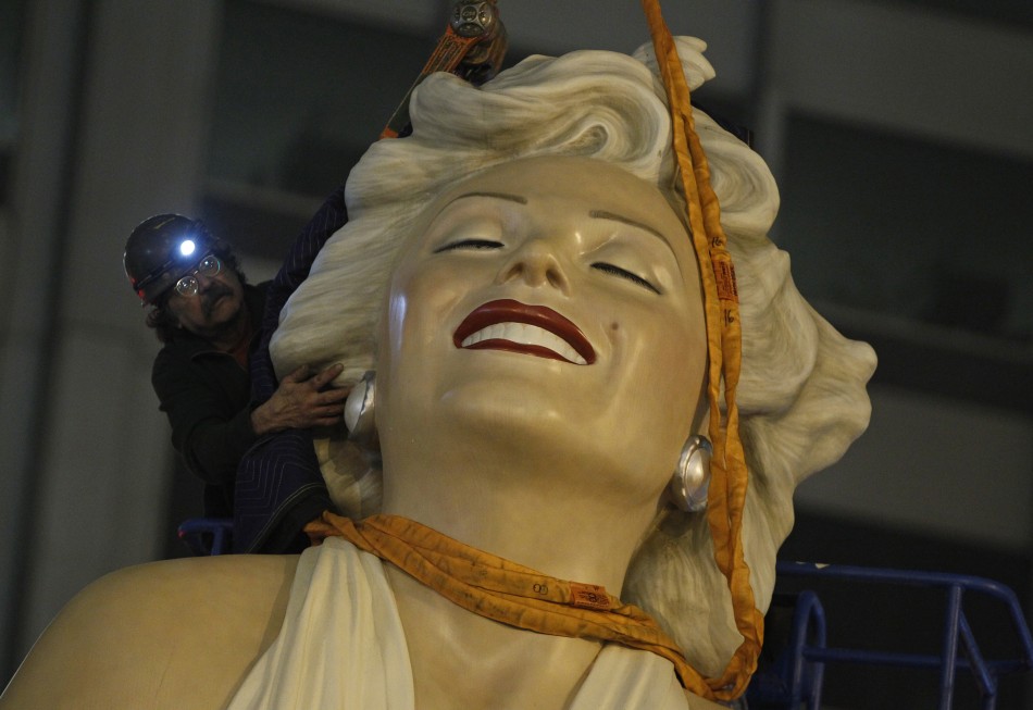 A worker prepares to disassemble a 26-foot tall statue of Marilyn Monroe in Chicago