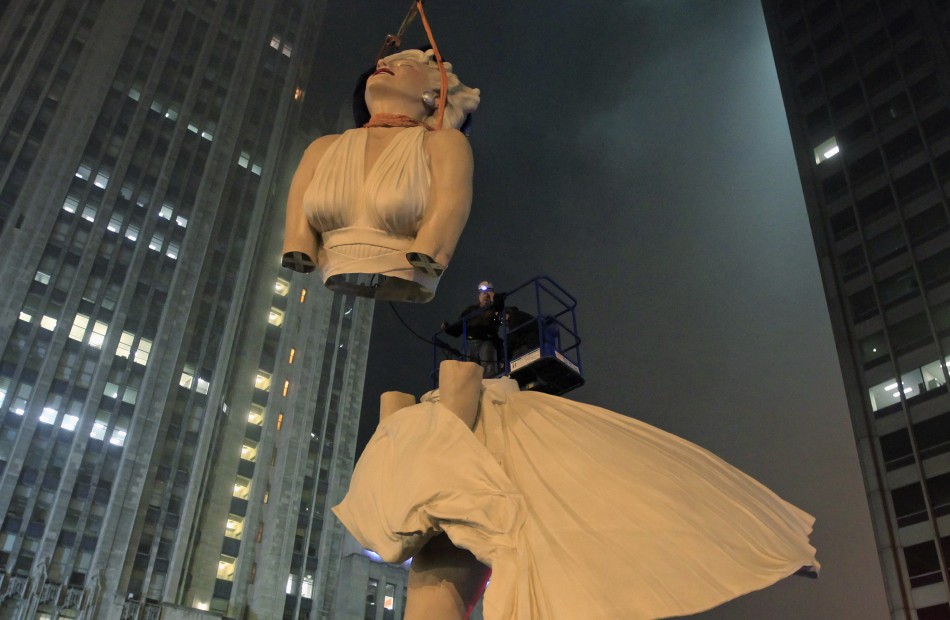 A 26-foot tall statue of Marilyn Monroe is separated for disassembly in Chicago