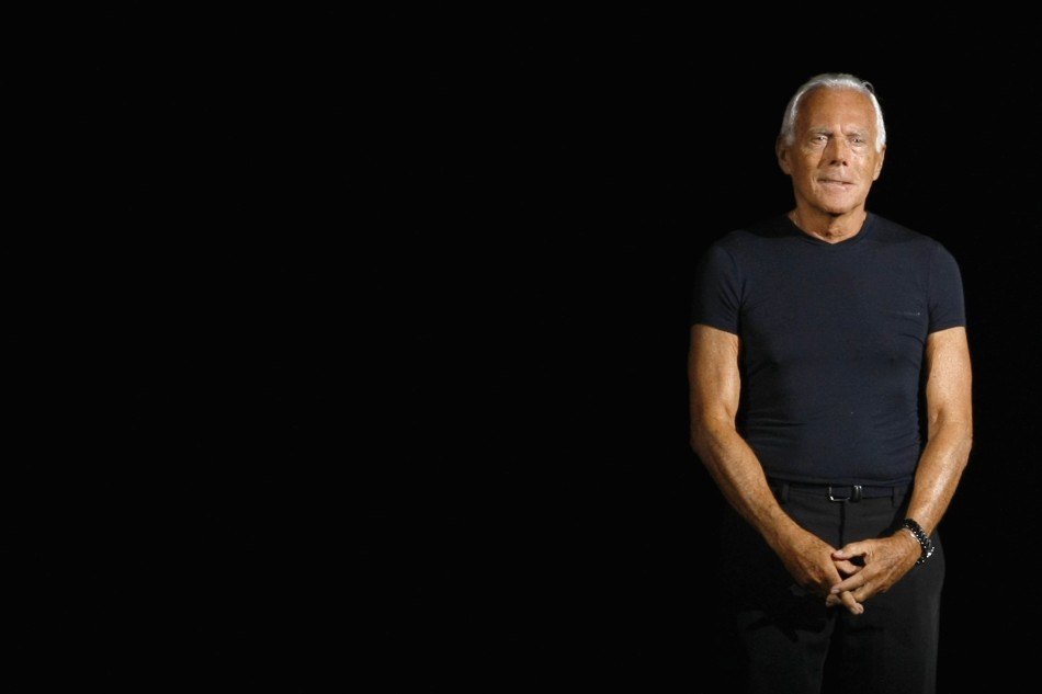 6. Italian designer Giorgio Armani acknowledges the applause at the end of his SpringSummer 2012 womens collection during Milan Fashion Week
