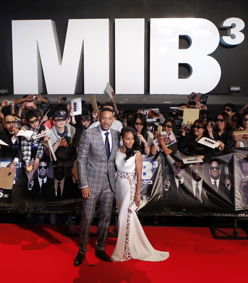 Cast member Will Smith and his wife Jada Pinkett Smith pose during a red carpet event to promote the film quotMen in Black IIIquot in Japan