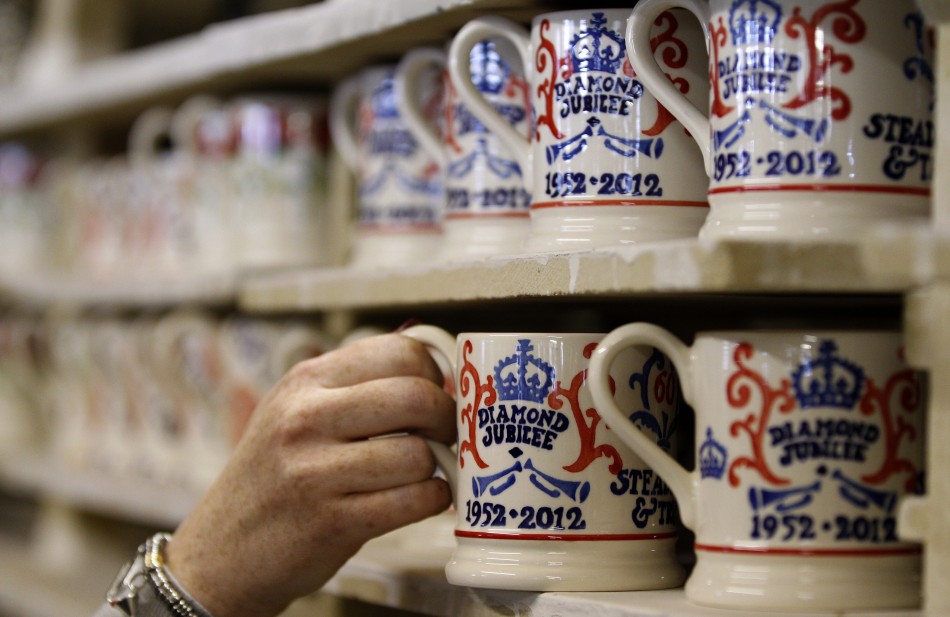 A worker examines a mug as part of the Diamond Jubilee Collection at the Emma Bridgewater pottery factory in Stoke-On-Trent